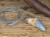 Wisior - amulet z ceramiczną repliką zęba niedźwiedzia jaskiniowego